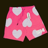 a pair of pink shorts with hearts on them